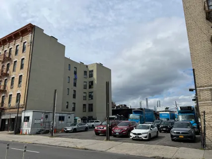 a view of a cars parked in front of a building