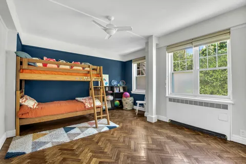 a bedroom with furniture and window