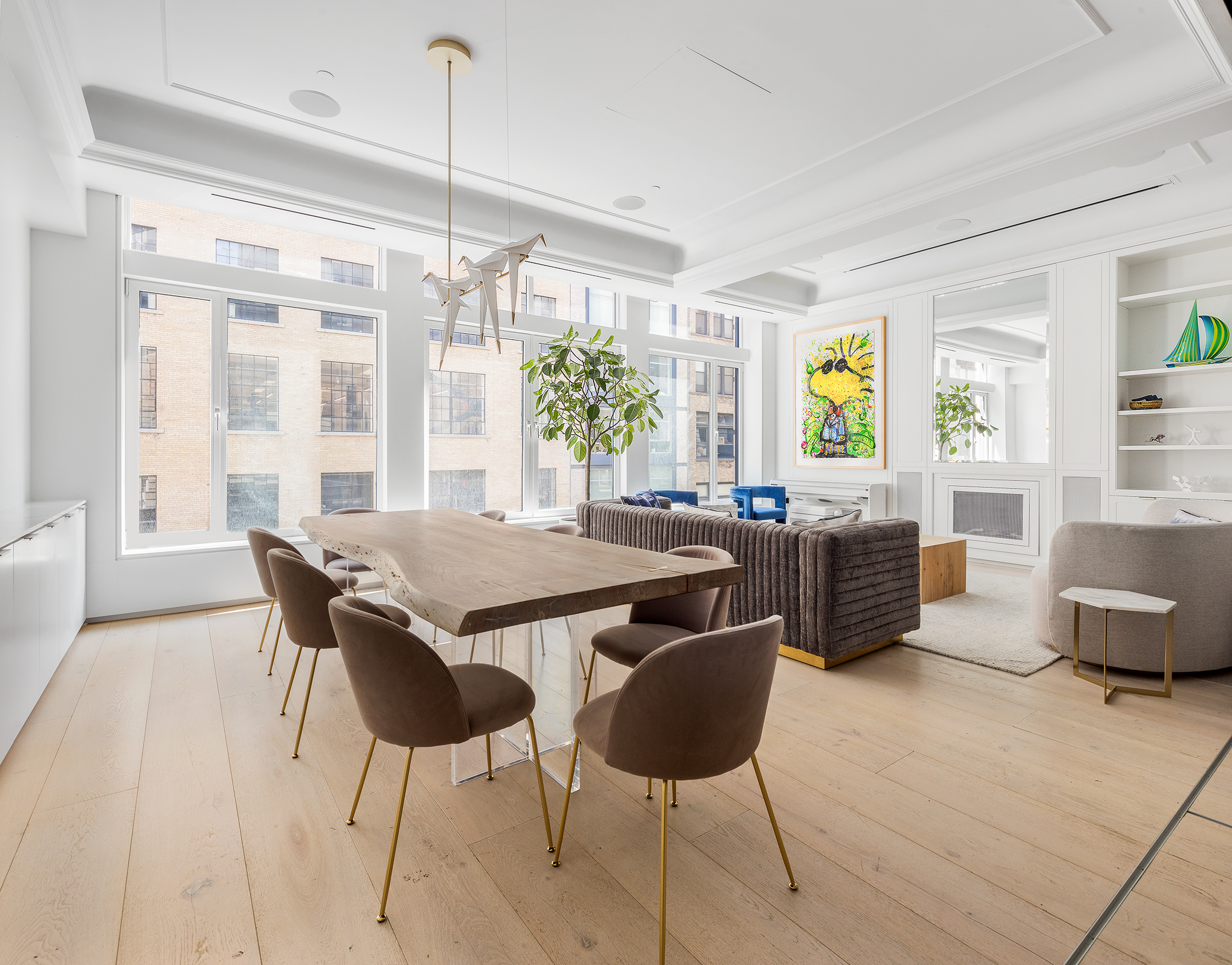 26 West 20th Street, Unit 3 Manhattan, NY 10011 - Photo 3 of 19 a view of a dining room with furniture a livingroom and chandelier