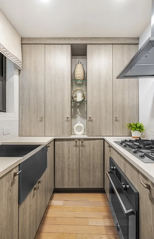 a bathroom with a granite countertop sink a toilet and a bathtub