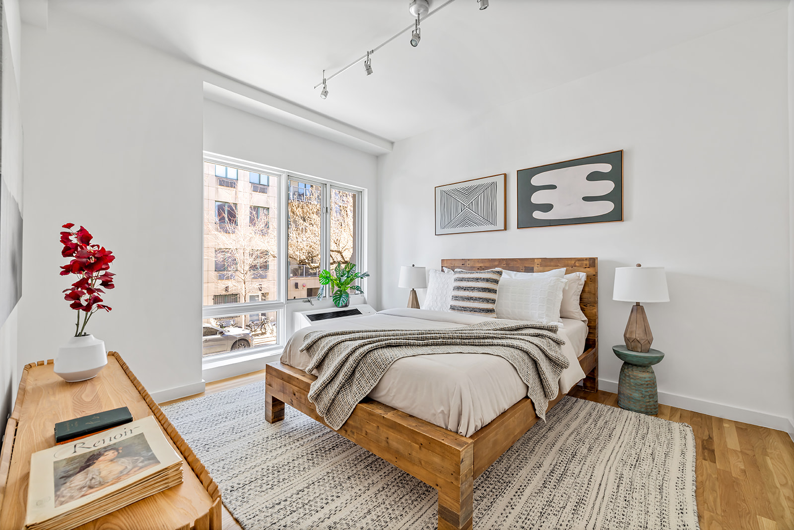 333 East 109th Street, Unit 2A Manhattan, NY 10029 - Photo 4 of 9 a bedroom with a bed and wooden floor