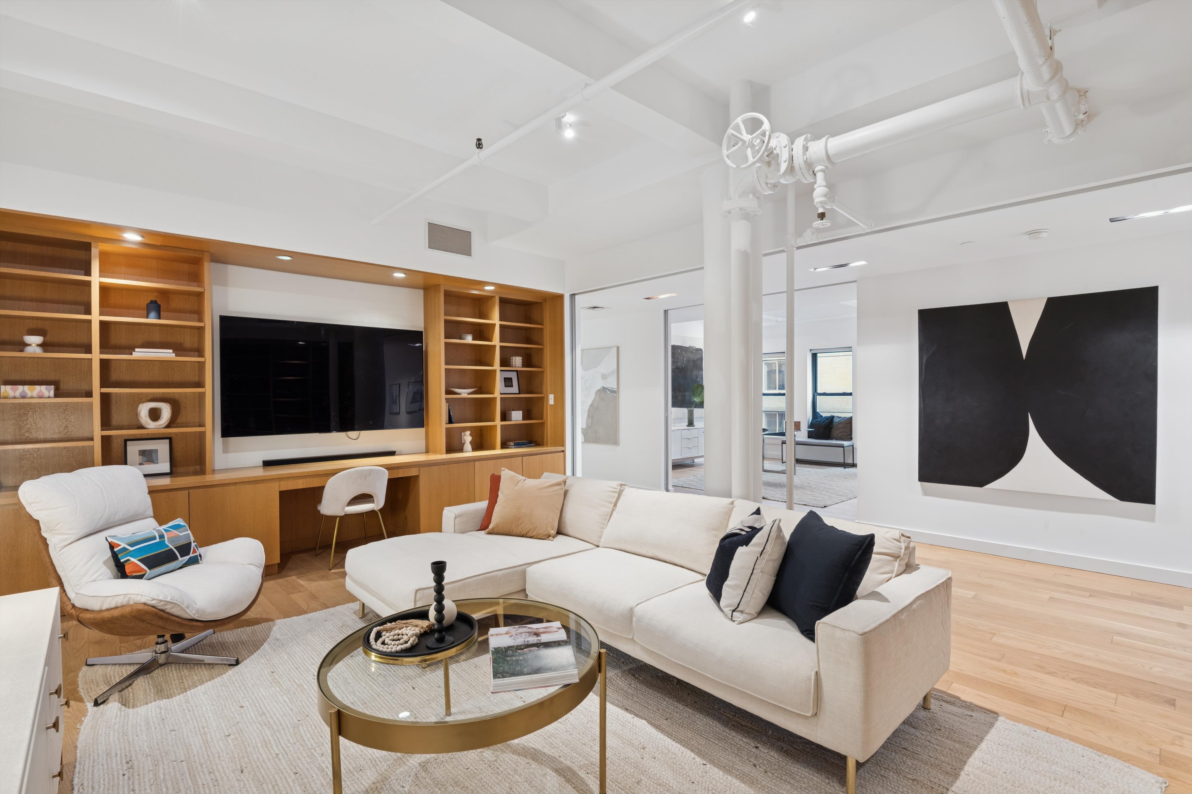 109 West 26th Street, Unit 9 Manhattan, NY 10001 - Photo 9 of 23 a living room with furniture and a flat screen tv