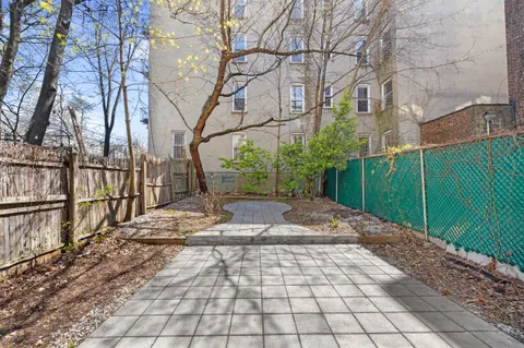 a view of a pathway with a white house