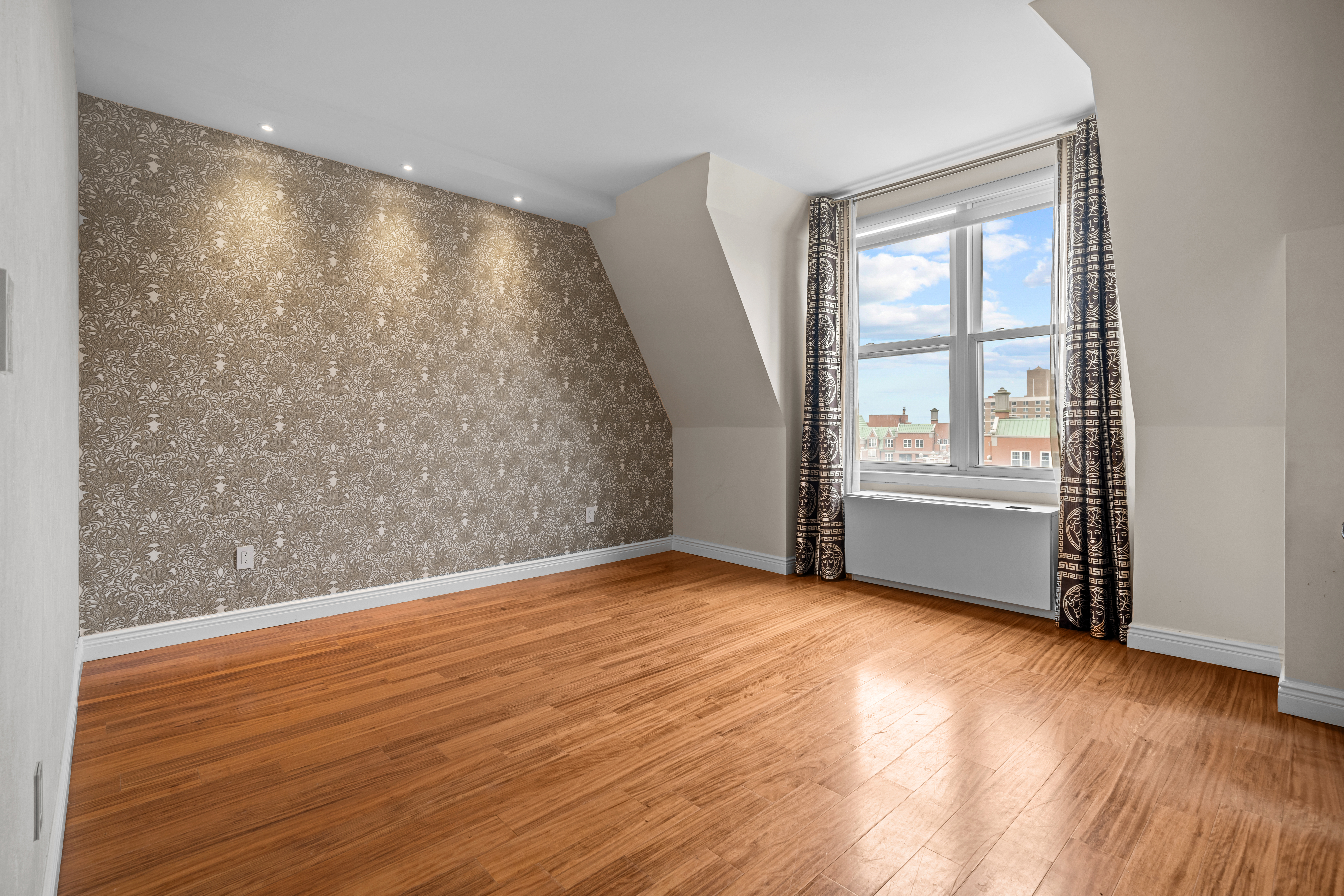 105 Oceana Drive East, Unit PH1D Brooklyn, NY 11235 - Photo 12 of 27 an empty room with wooden floor and windows