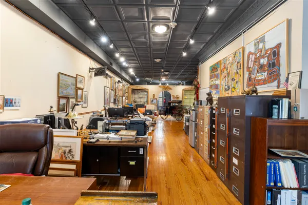 a view of a living room and kitchen