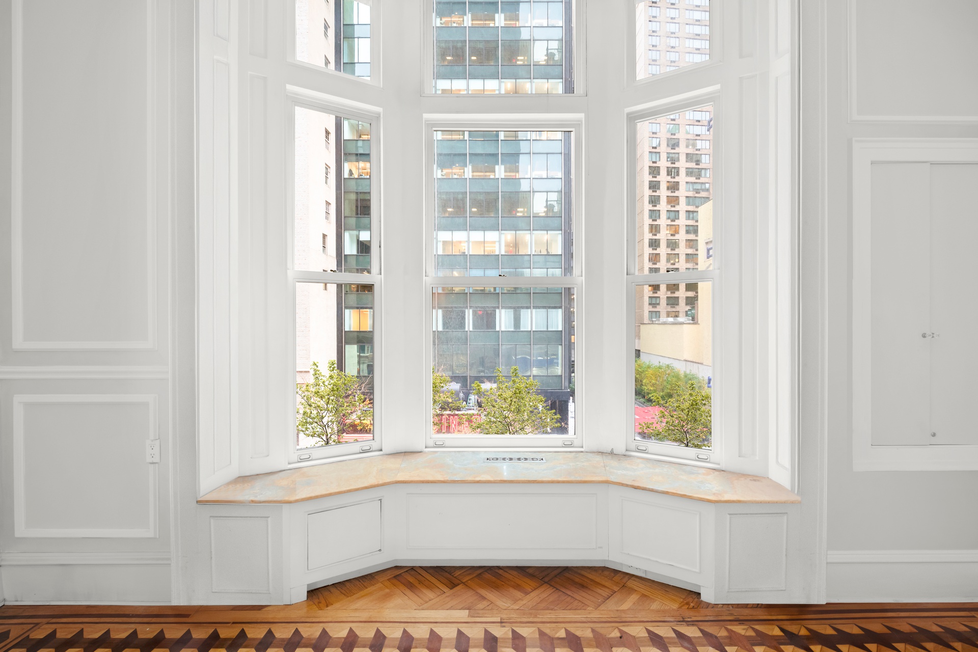 205 West 57th Street, Unit 3DB Manhattan, NY 10019 - Photo 4 of 25 a view of an entryway with wooden floor and a window