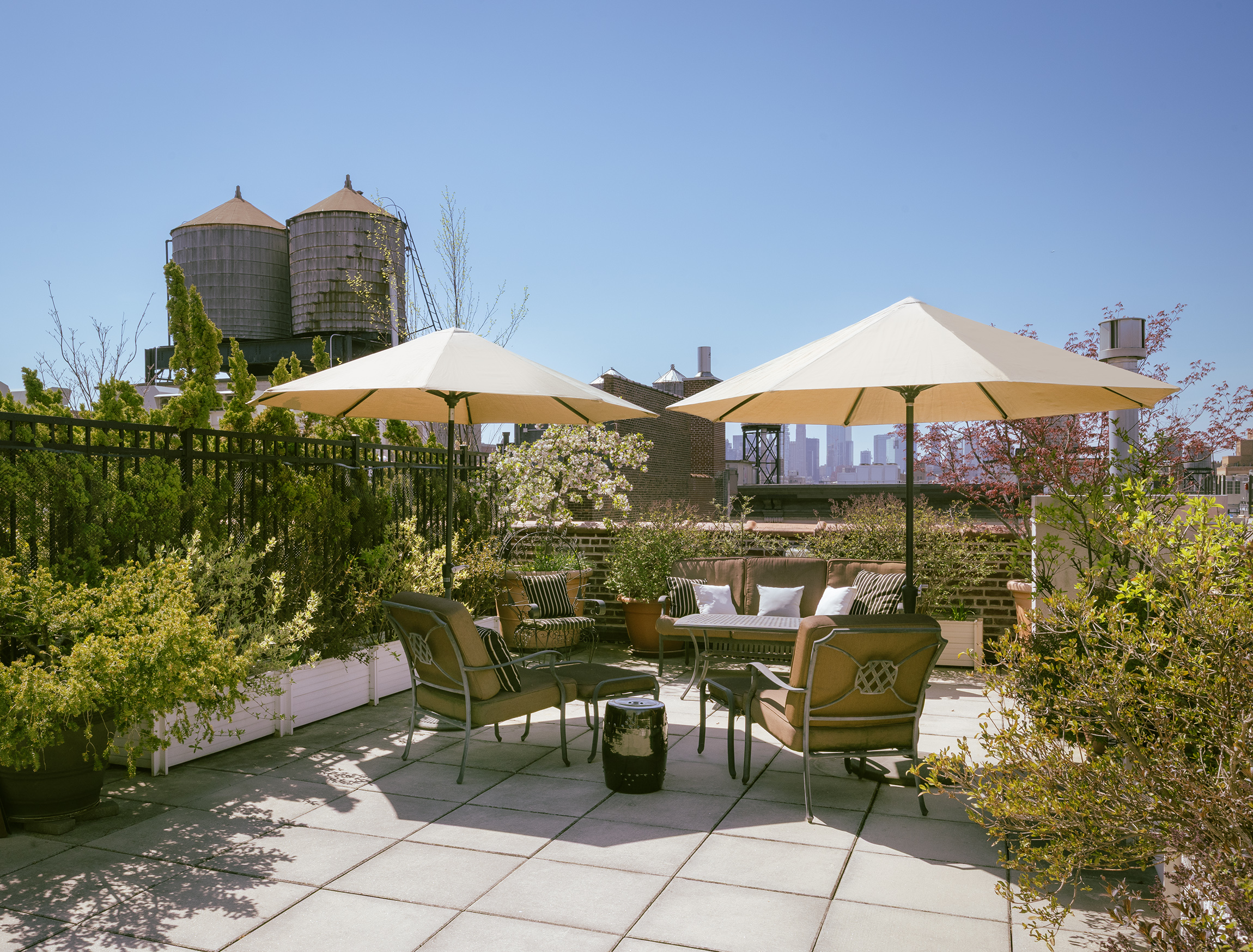 140 West 22nd Street, Unit PHC Manhattan, NY 10011 - Photo 12 of 15 a view of a patio with chairs under an umbrella