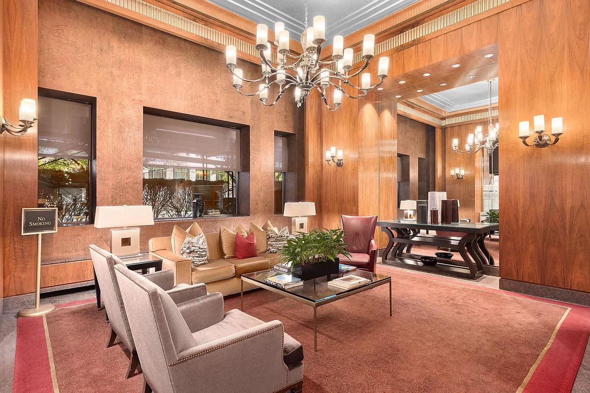 161 West 61st Street, Unit 19D Manhattan, NY 10023 - Photo 4 of 12 a living room with furniture a chandelier and a dining table