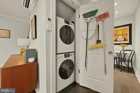 a view of a hallway with washer and dryer