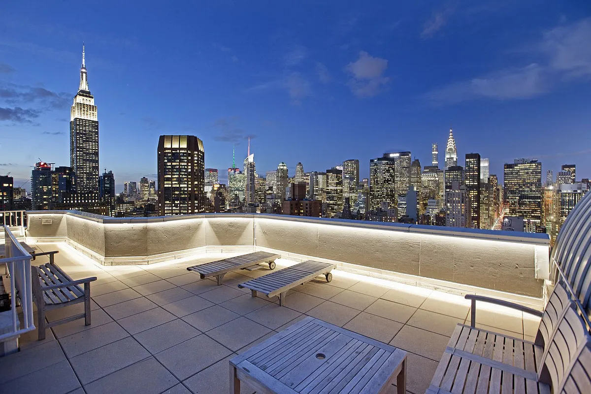 200 East 32nd Street, Unit 35C Manhattan, NY 10016 - Photo 18 of 26 a view of roof deck with table and chairs