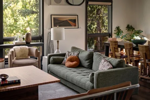 a living room with furniture and a window