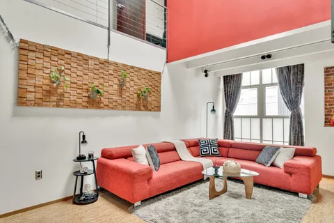 a living room with furniture and a window