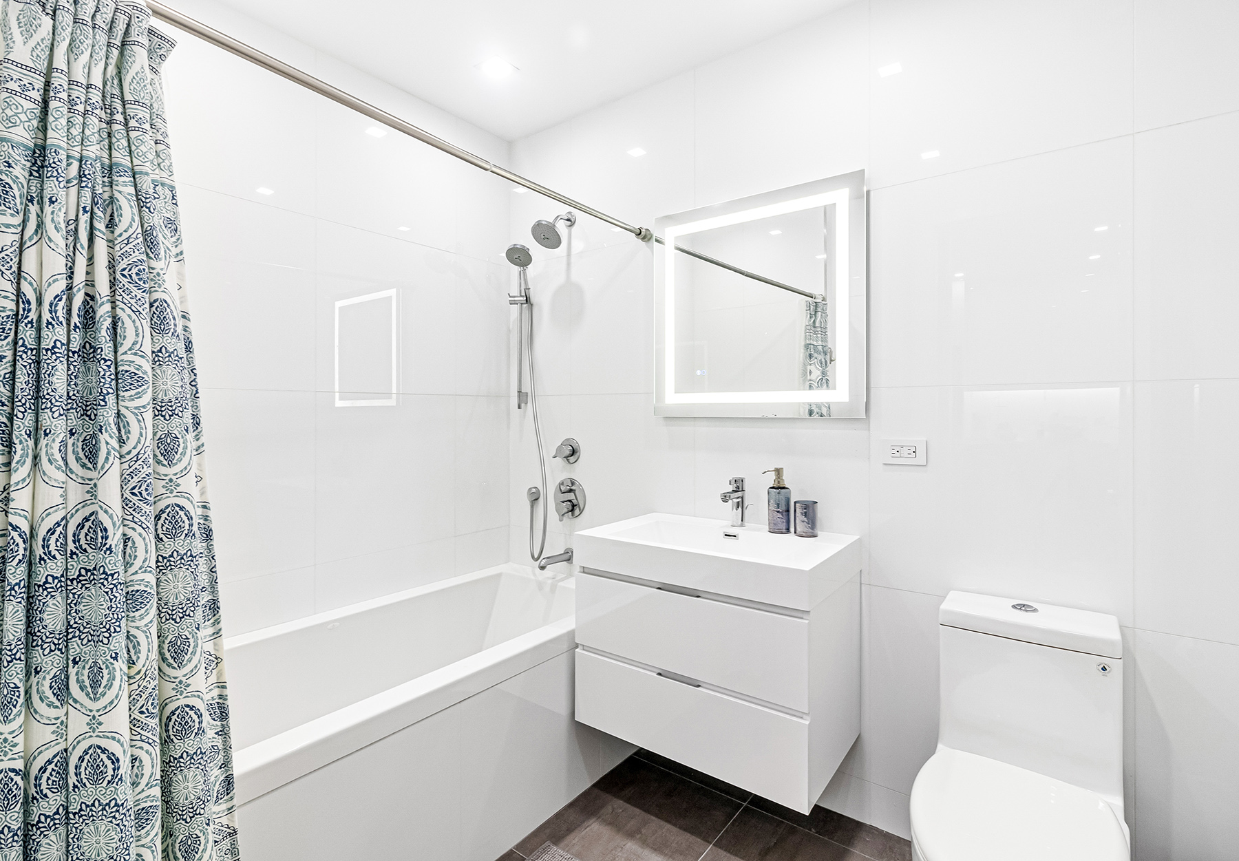 309 Ocean Parkway, Unit 4F Brooklyn, NY 11218 - Photo 8 of 14 a bathroom with a sink toilet and shower