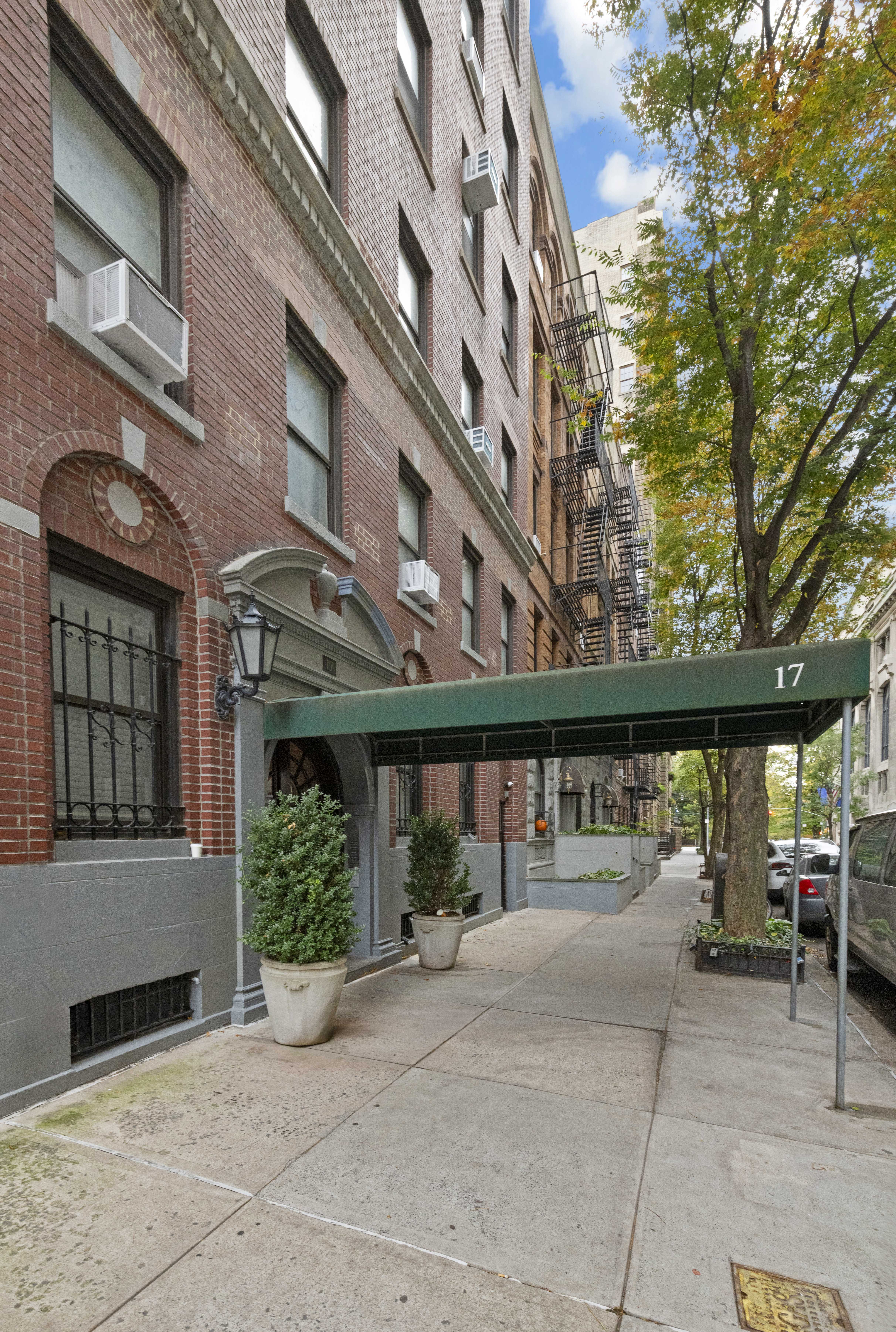 17 West 64th Street, Unit 4E Manhattan, NY 10023 - Photo 6 of 9 a view of a building with car parked