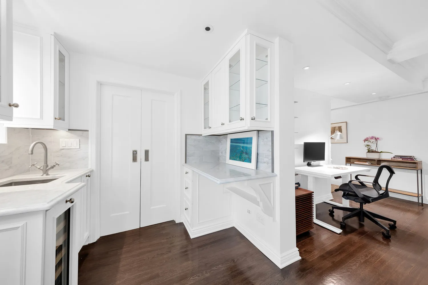 a view of kitchen with workspace and a sink