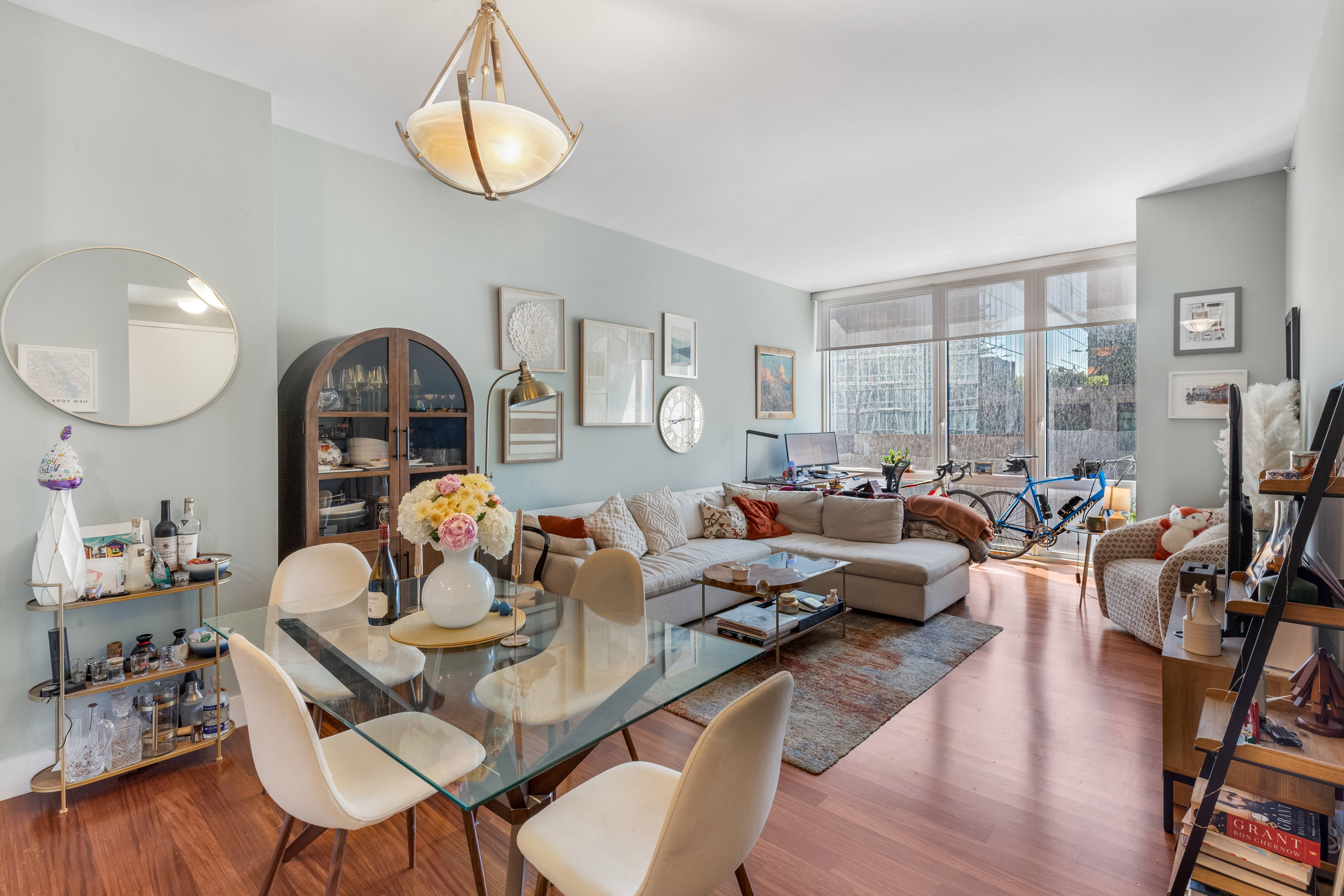 a living room with lots of furniture and a chandelier