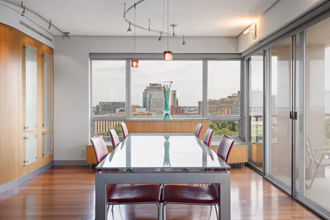 a view of bathroom with a tub and mirror