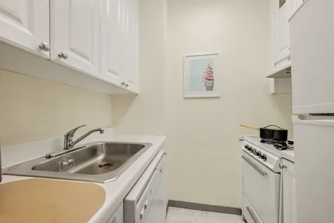 a close view of a sink and dishwasher in kitchen