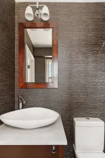 a bathroom with a toilet and a sink