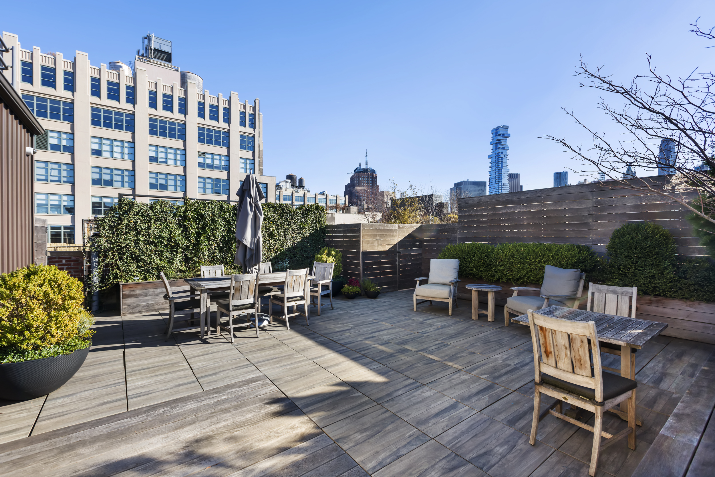 463 Greenwich Street Manhattan, NY 10013 - Photo 17 of 24 a view of a patio with dining table and chairs