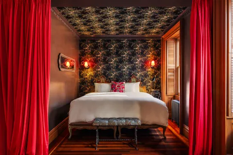 a bed room with a bed and a window