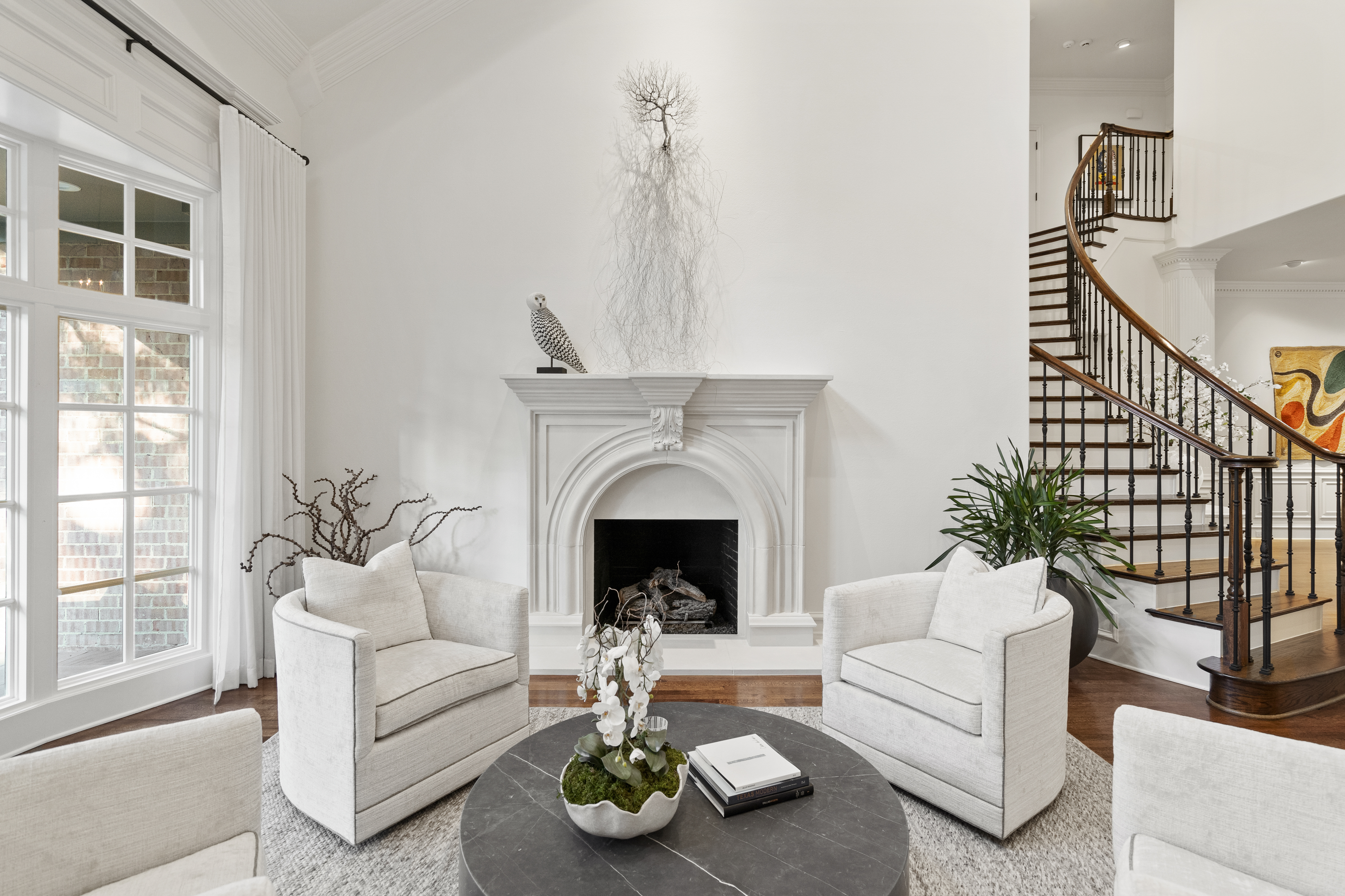 6607 Meadow Road Dallas, TX 75230 - Photo 6 of 32 a living room with furniture and a fireplace