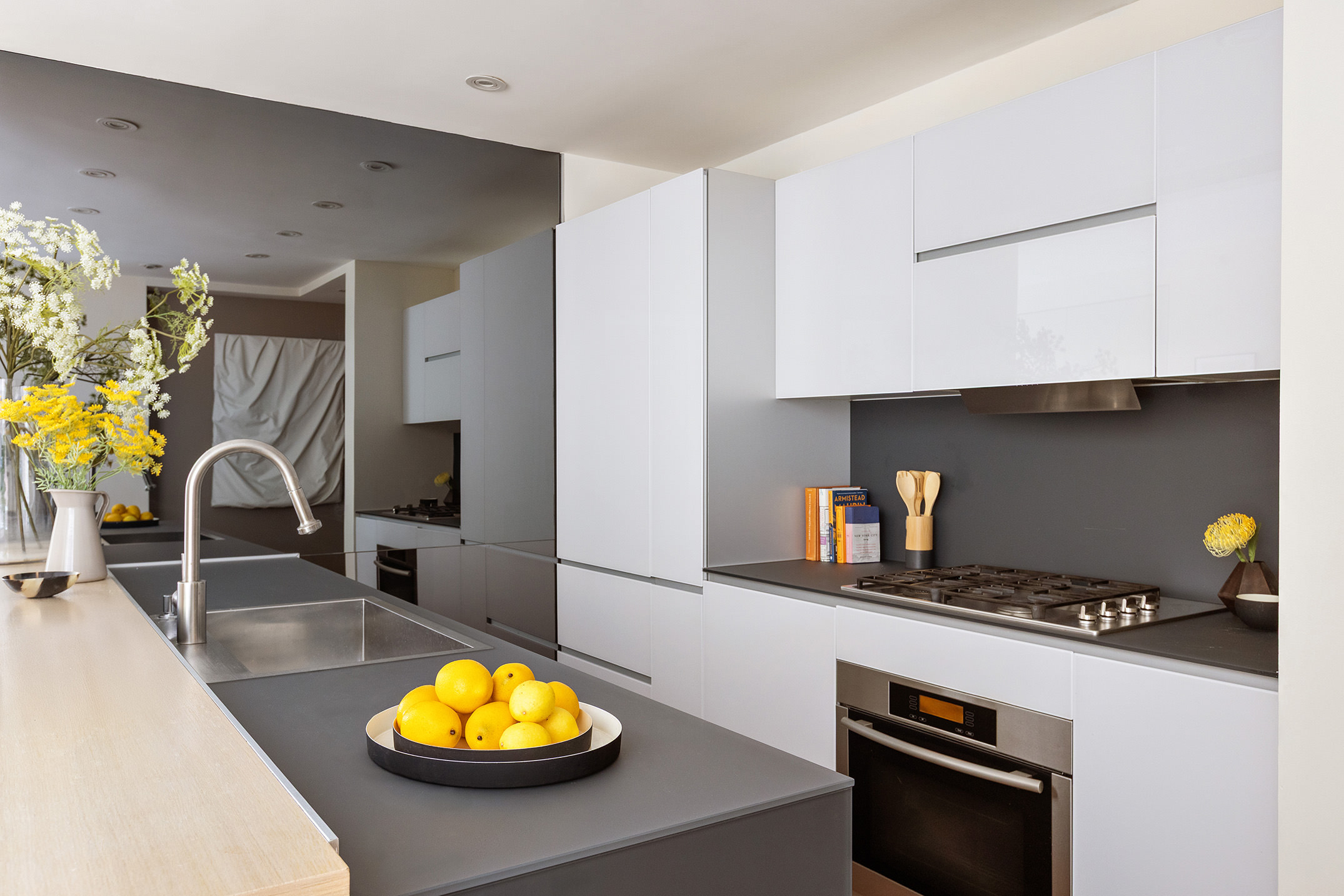 166 West 18th Street, Unit 4A Manhattan, NY 10011 - Photo 5 of 14 a kitchen with a sink appliances and cabinets