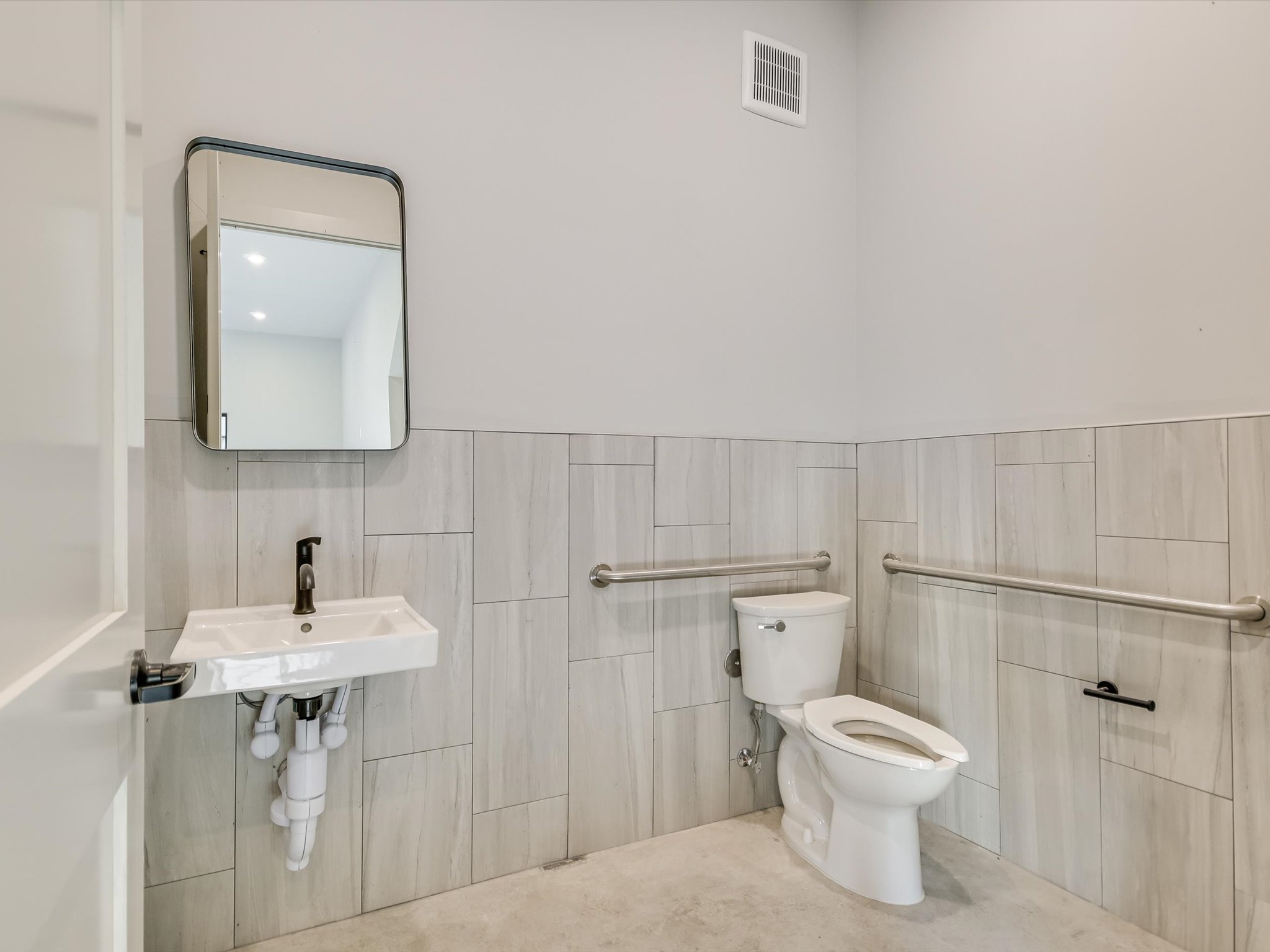 15210 Fitzhugh Road, Unit 800 Austin, TX 78736 - Photo 11 of 18 a bathroom with a toilet sink and mirror