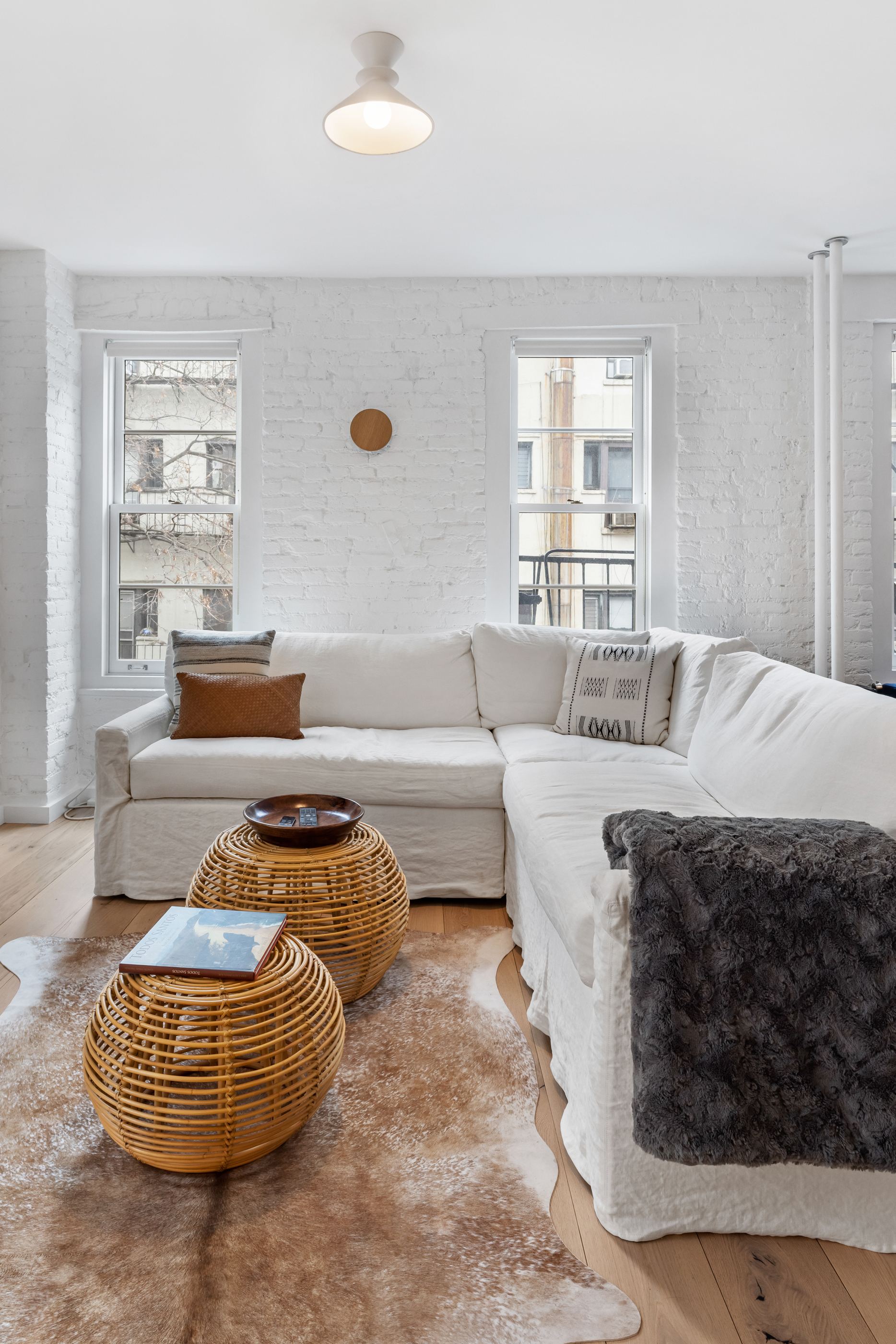 57 Thompson Street, Unit 4E Manhattan, NY 10012 - Photo 7 of 16 a living room with furniture and a window