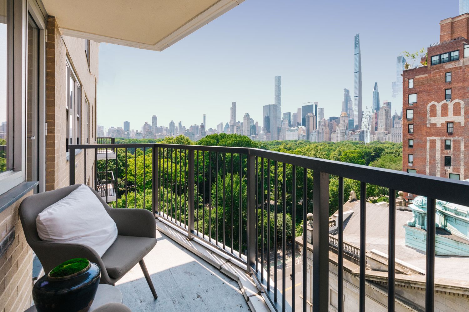 a kitchen with stainless steel appliances granite countertop white cabinets and a refrigerator