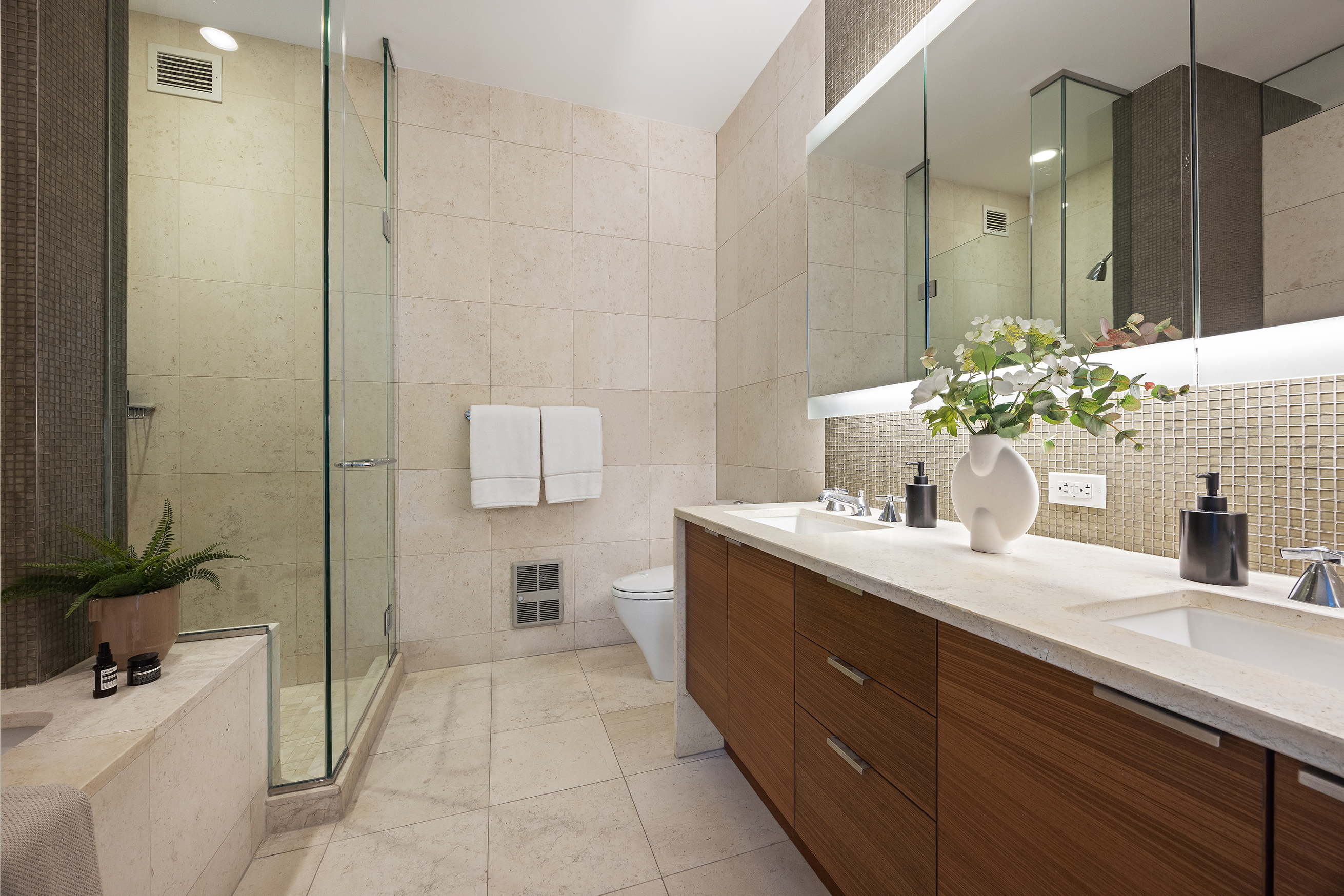 70 Little West Street, Unit 7L Manhattan, NY 10004 - Photo 16 of 25 a bathroom with a sink and a mirror