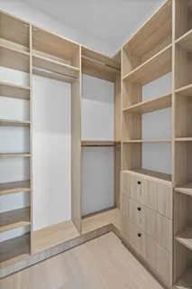 a view of an empty walk in closet
