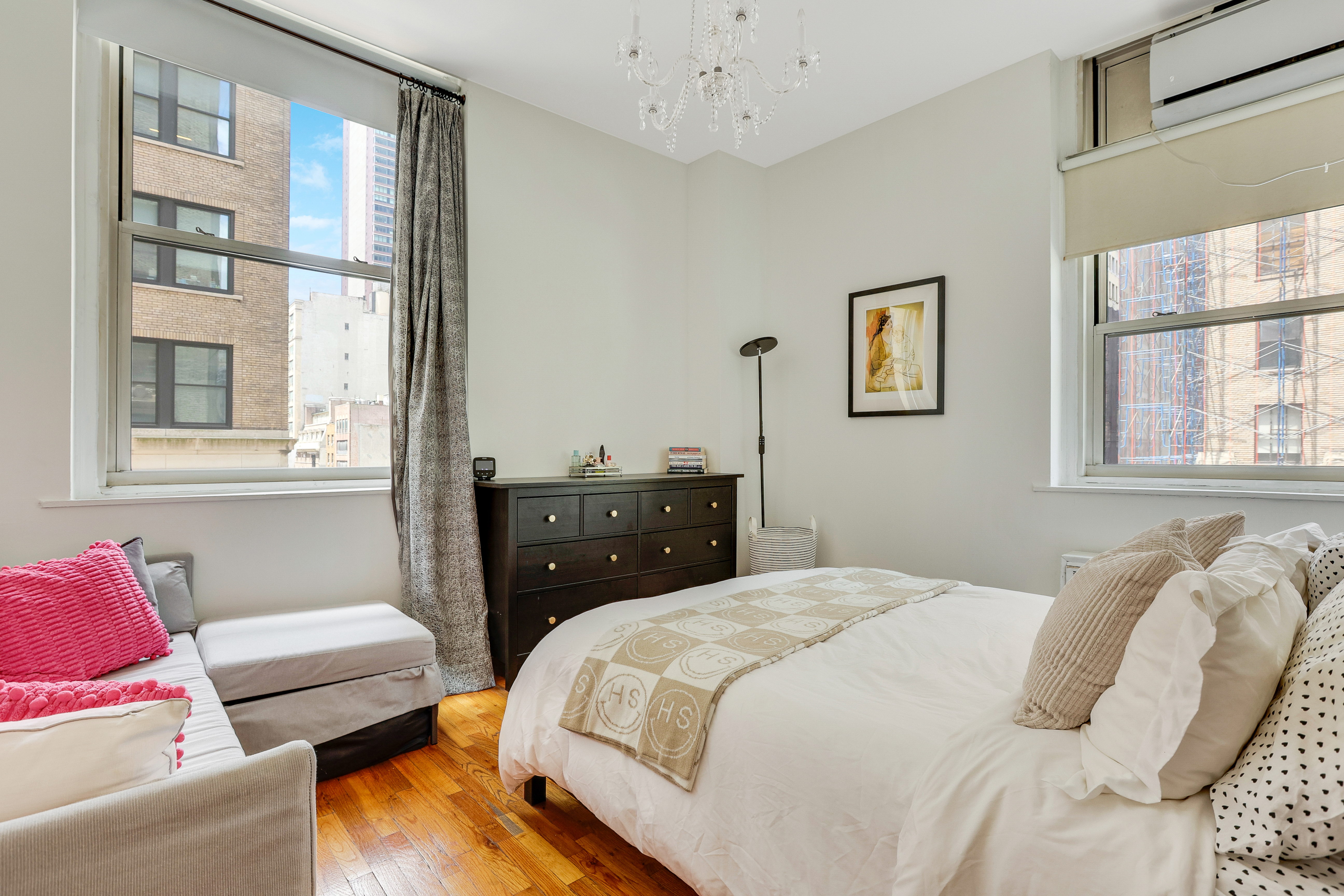 159 Madison Avenue, Unit 4G Manhattan, NY 10016 - Photo 4 of 14 a bedroom with a bed and wooden floor