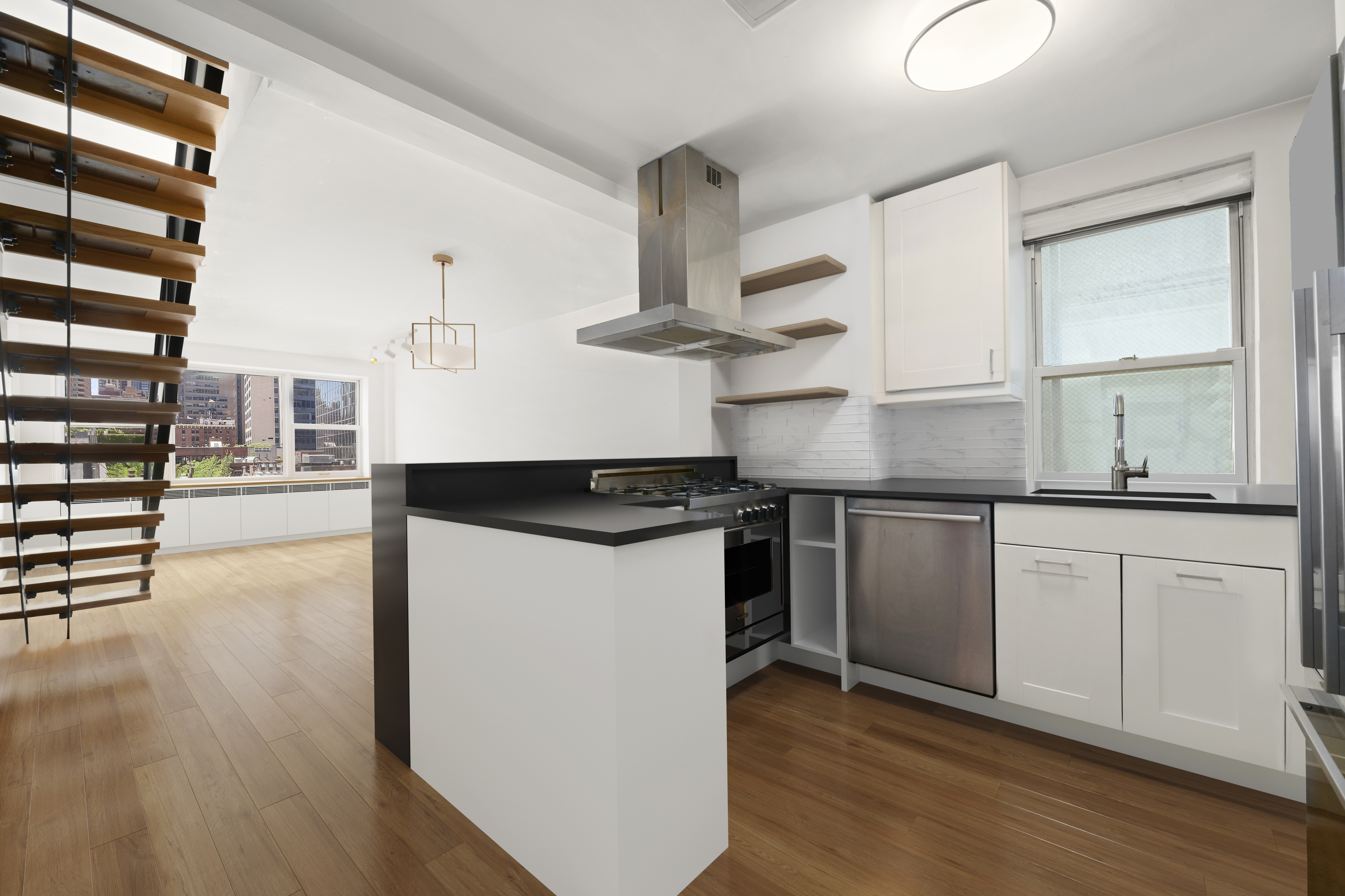 221 East 50th Street, Unit 6D/7D Manhattan, NY 10022 - Photo 8 of 19 a kitchen with stainless steel appliances granite countertop a sink a stove and white cabinets with wooden floor