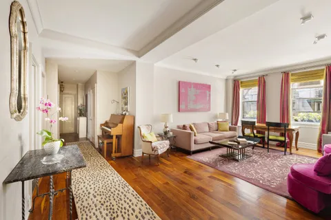 a living room with furniture or couch and a window