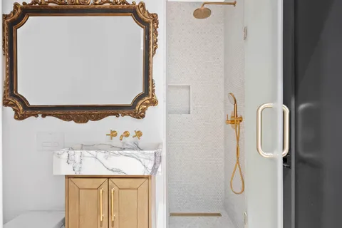 a bathroom with a sink and mirror