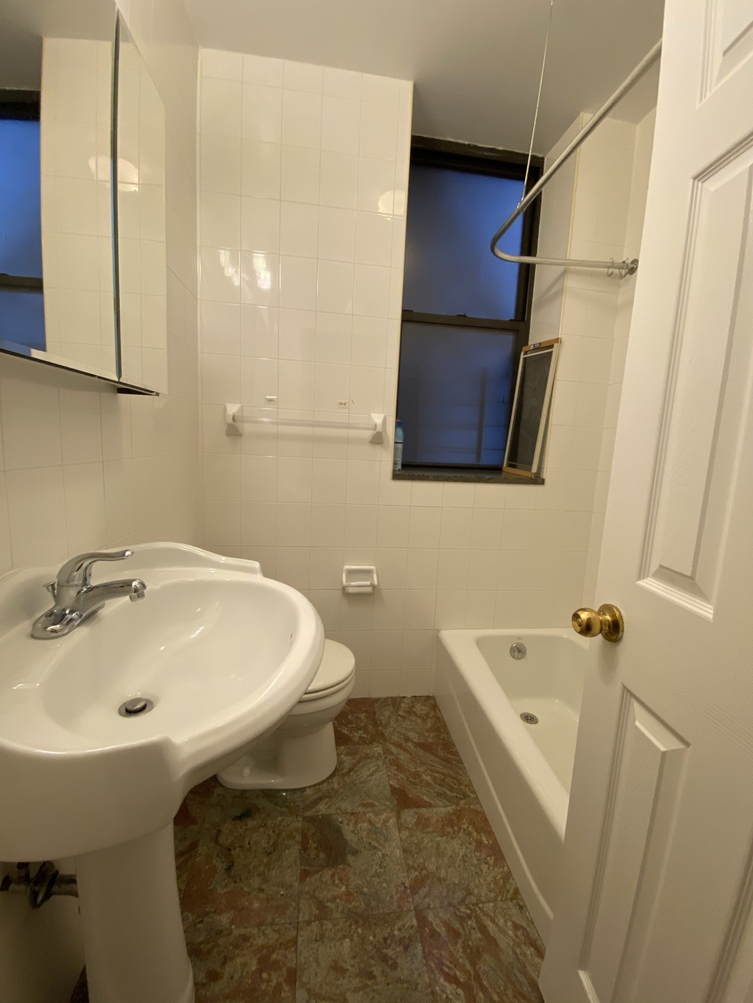839 West End Avenue, Unit 3D Manhattan, NY 10025 - Photo 7 of 9 a bathroom with a sink and mirror with toilet