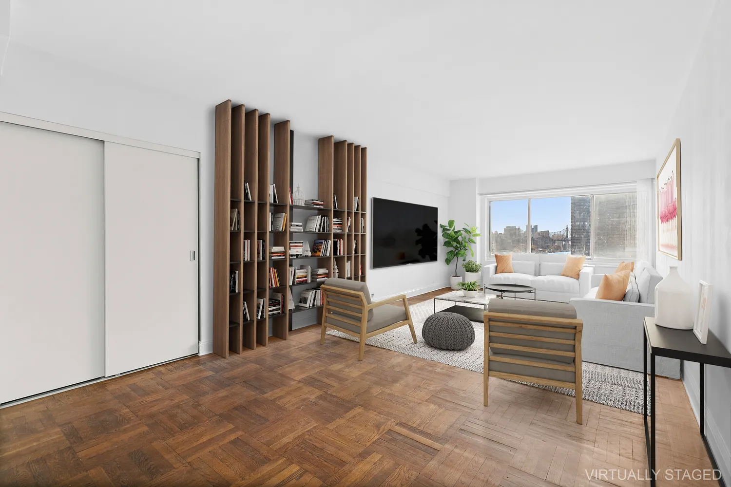 a living room with furniture a flat screen tv and a floor to ceiling window