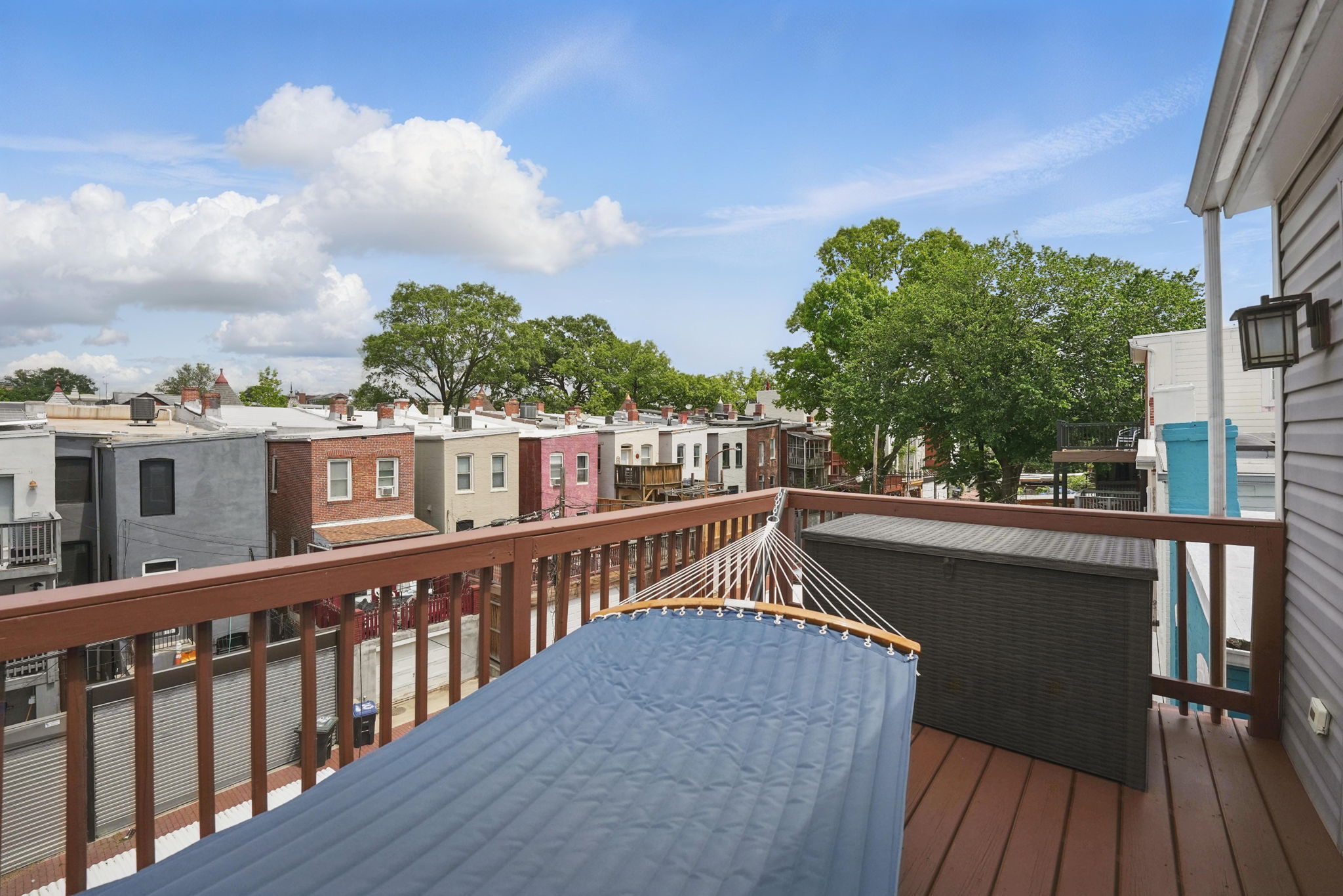 28 Q Street Northeast, Unit 2 Washington, DC 20002 - Photo 35 of 41 a view of a roof deck with wooden floor and fence