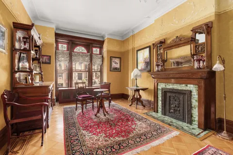 a living room with furniture rug and window