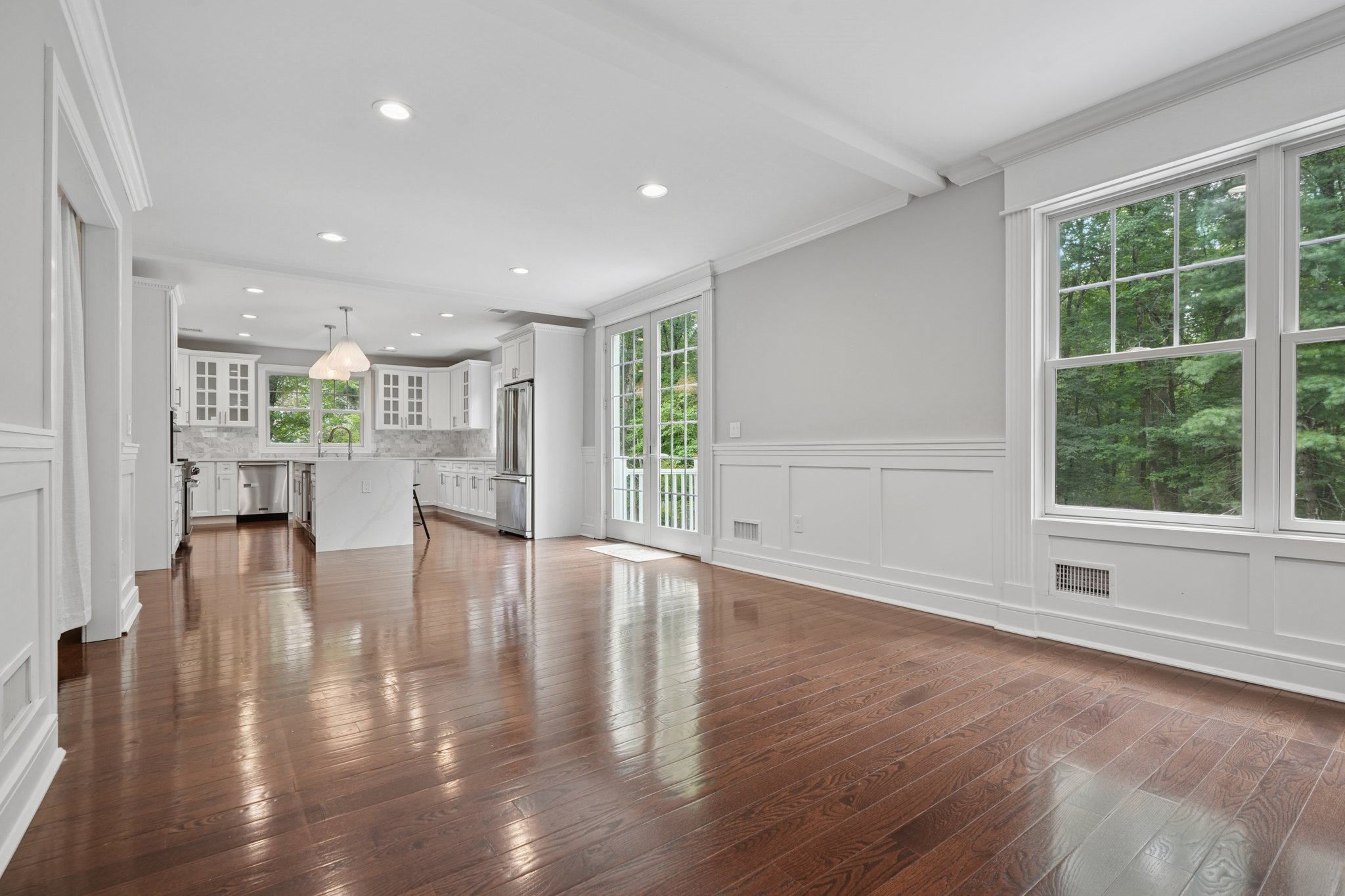 823 River Road Chatham, NJ 07928 - Photo 8 of 60 a view of an empty room with wooden floor and a window