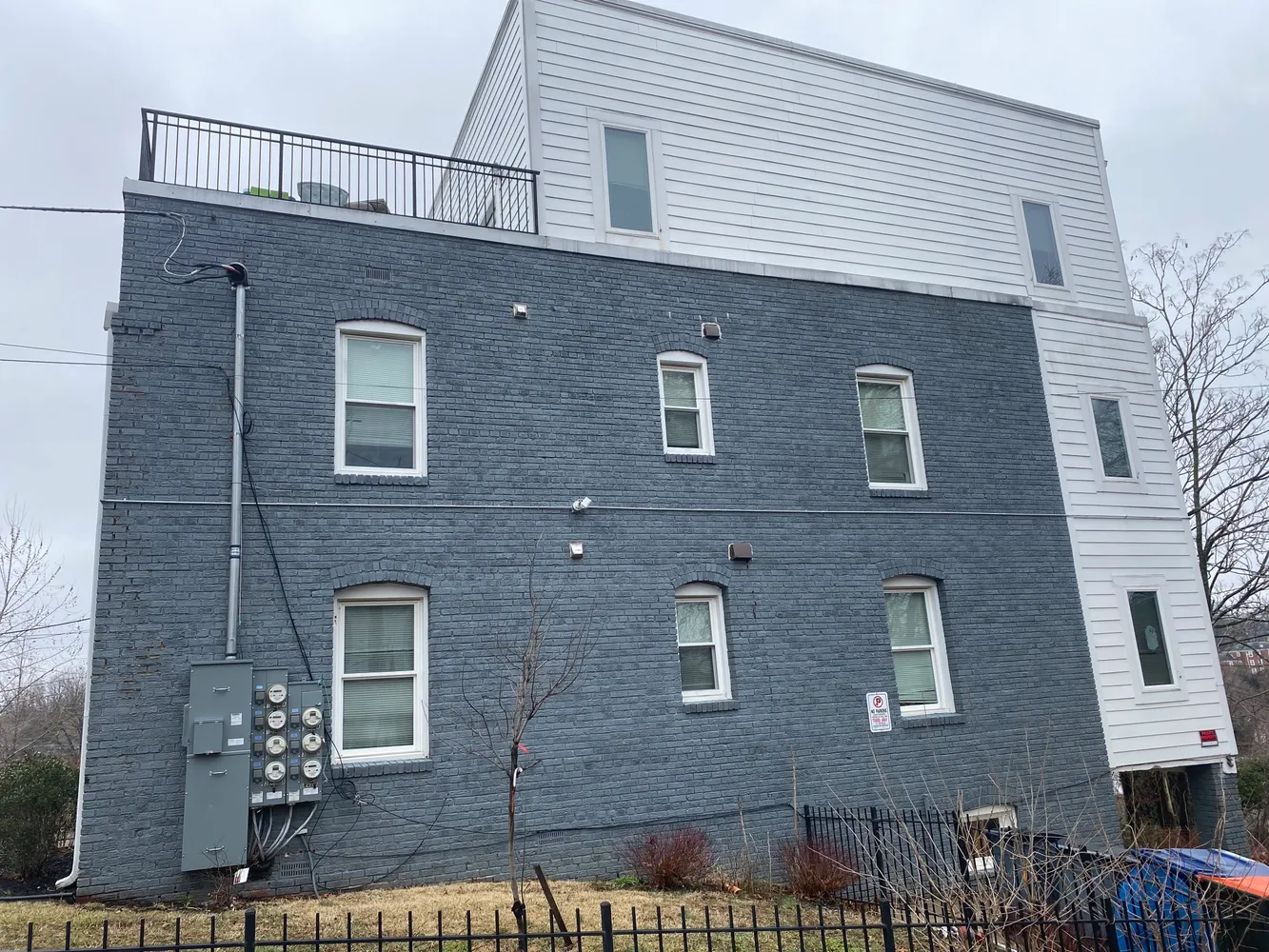 a front view of a house with brick walls