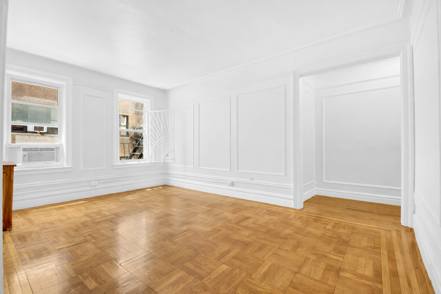720 West 173rd Street, Unit 23 Manhattan, NY 10032 - Photo 3 of 10 a view of an empty room with a window