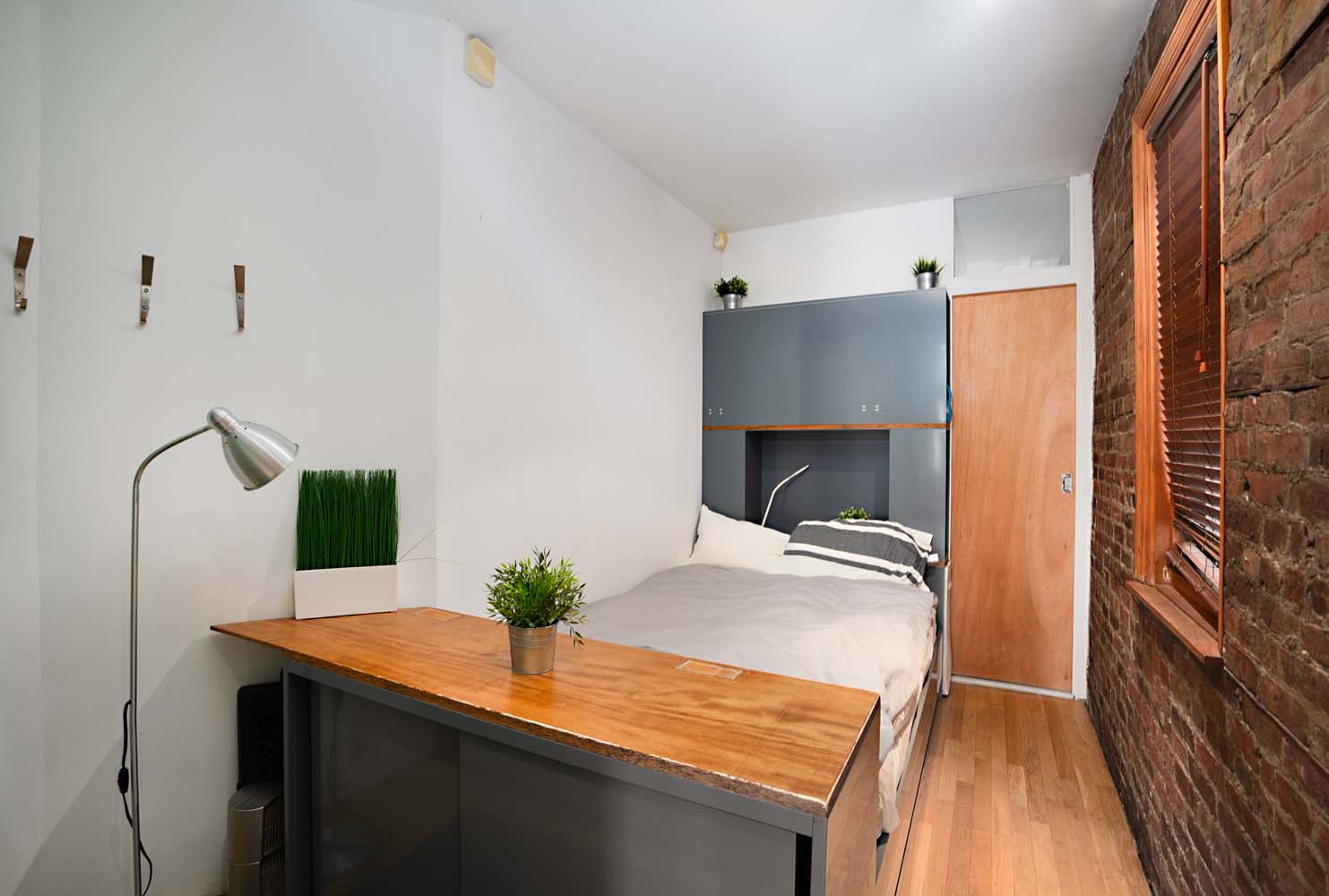 218 East 82nd Street, Unit 4FW Manhattan, NY 10028 - Photo 7 of 9 a room with a sink and a refrigerator