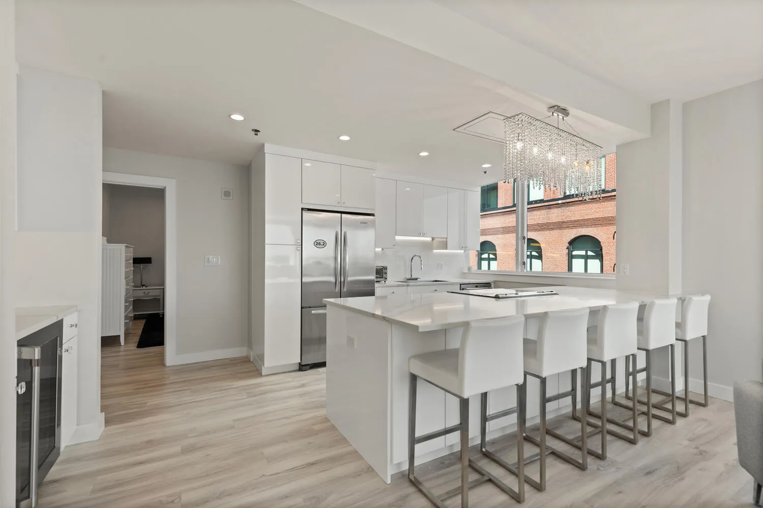 a kitchen with stainless steel appliances a sink and a refrigerator