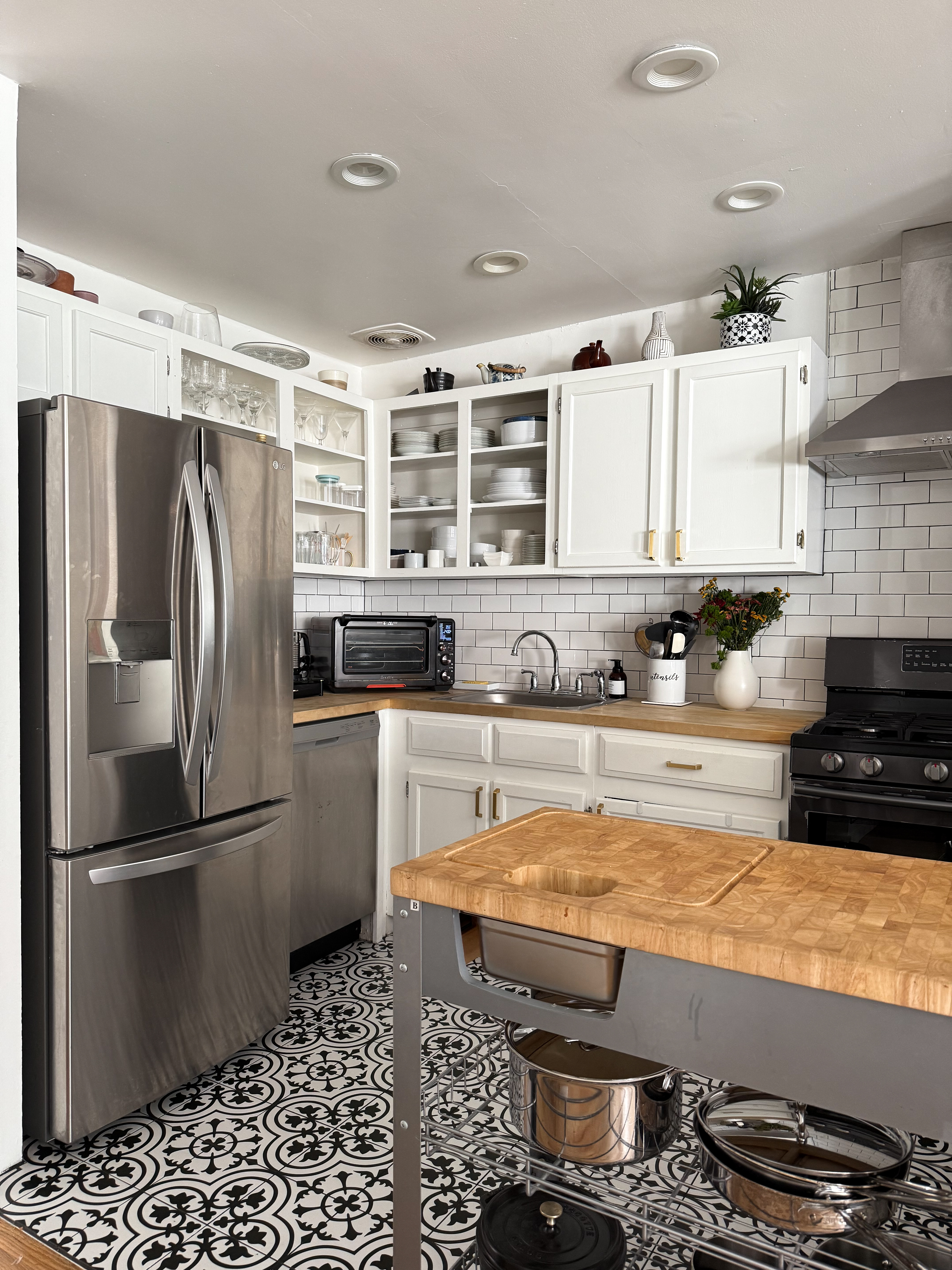 65 South 4th Street, Unit 2 Brooklyn, NY 11249 - Photo 4 of 12 a kitchen with stainless steel appliances granite countertop a refrigerator stove and sink
