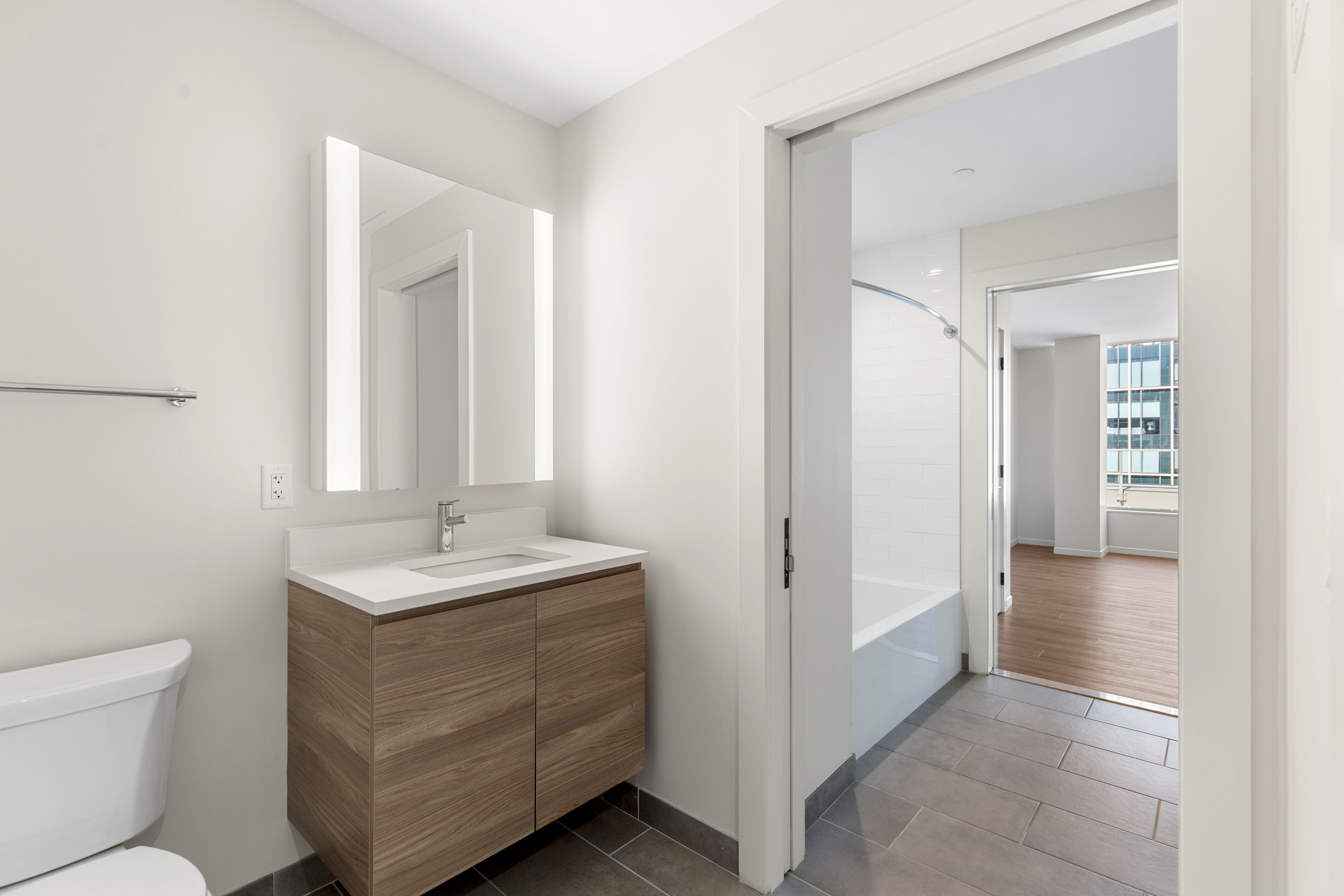 131 Seaport Boulevard Boston, MA 02210 - Photo 8 of 11 a bathroom with a sink and a mirror