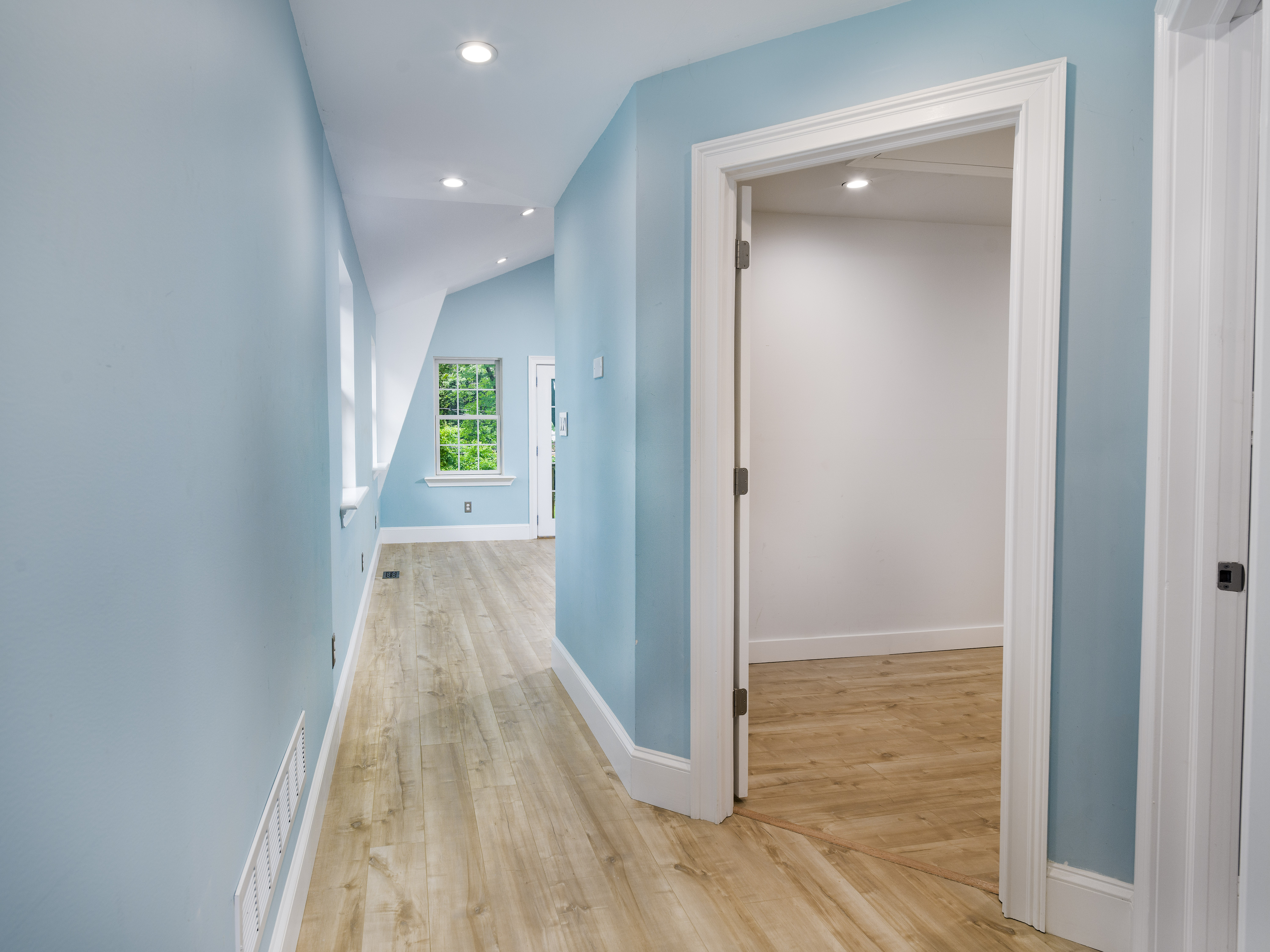 319 West Conestoga Road Devon, PA 19333 - Photo 19 of 38 a view of a hallway with wooden floor and a bathroom