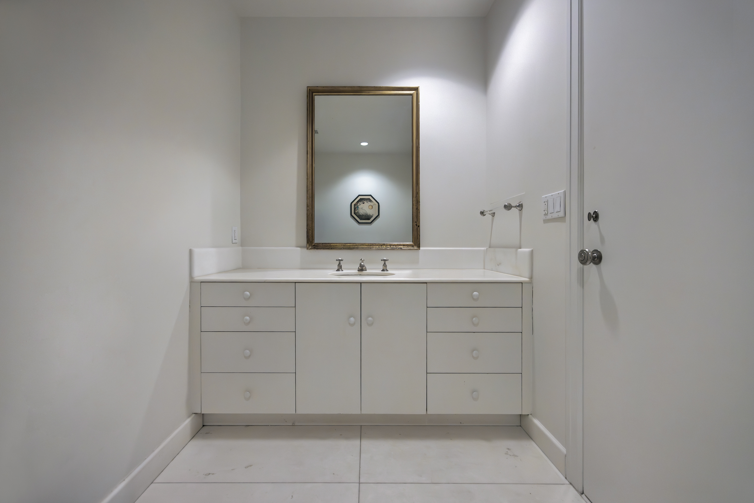 260 West Broadway, Unit 10D Manhattan, NY 10013 - Photo 14 of 20 a bathroom with a sink vanity and a mirror