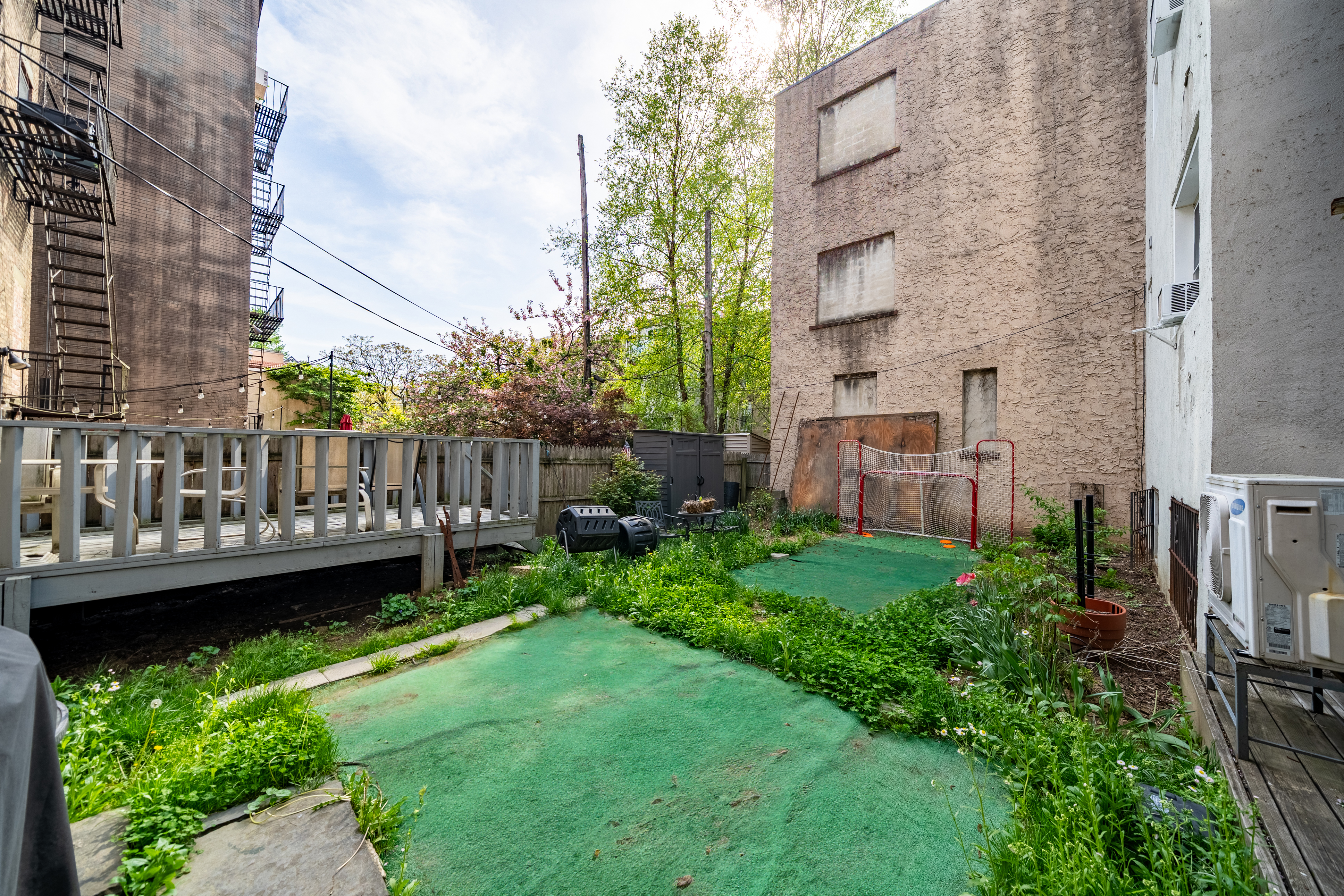 155 3rd Street Hoboken, NJ 07030 - Photo 16 of 18 a view of a wooden deck in front of a building